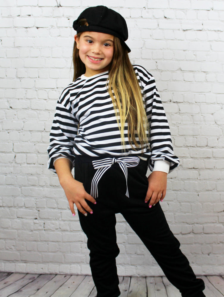 This two piece Chill Set is a super fashionable "everyday" outfit. The long sleeves have added fabric to make them puff out slightly and the pants are tied with a bow. The pants come tight around the ankle. Your little Diva / Tween girl is going to love how comfy it is!