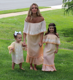 This Ombre Embroidered Tunic Dress has a beautiful silhouette with tiered fluttered sleeves. With the ultra-soft material this dress is fit for any occasion. The calming color contrast is of a beautiful sun rise and will leave people taking a double look!  Don't forget to check out the Mommy and Me set to match your mini in style!