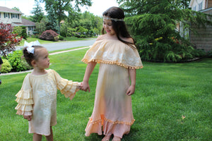 This Ombre Embroidered Tunic Dress has a beautiful silhouette with tiered fluttered sleeves. With the ultra-soft material this dress is fit for any occasion. The calming color contrast is of a beautiful sun rise and will leave people taking a double look!  Don't forget to check out the Mommy and Me set to match your mini in style!