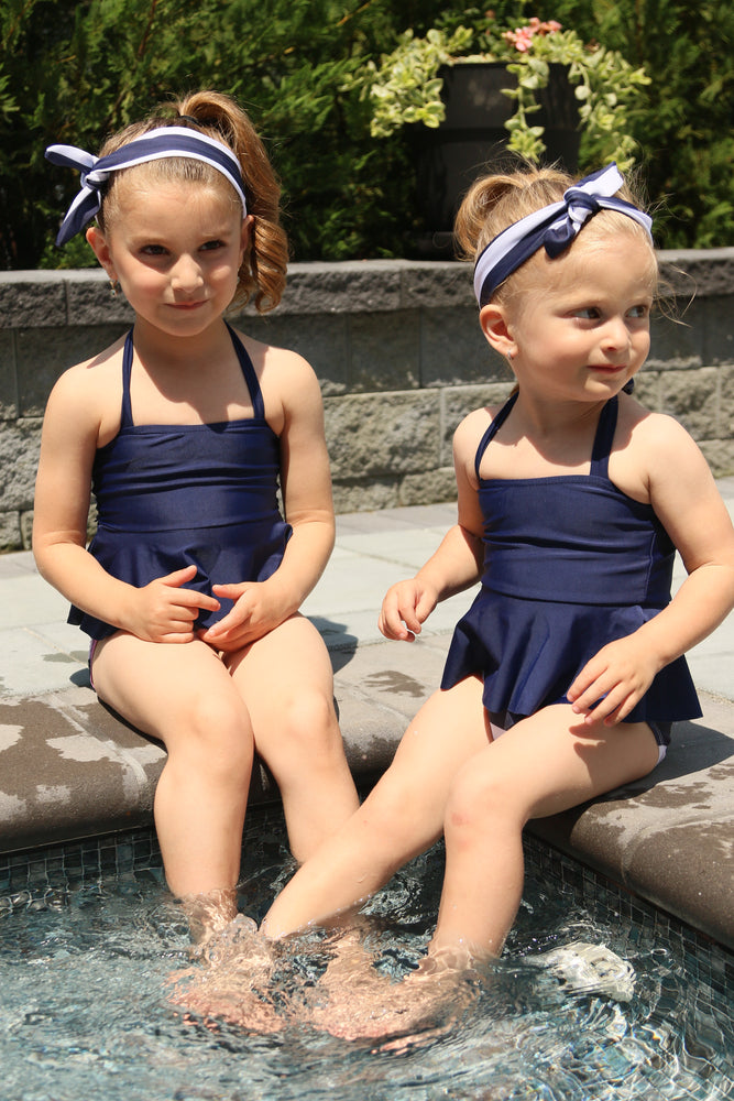 Get ready for The Hamptons with this Nautical Glam 3 piece suit. Set includes nautical colored bottom with 4 gold buttons, navy halter top and nautical striped head wrap. 