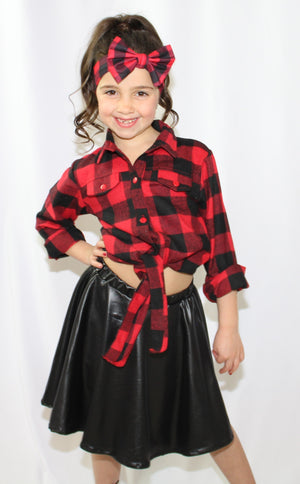 Sassy and Chic! This two piece set is a perfect twist on a typical Fall outfit. The set includes long sleeve top that ties in a knot in the front and a leather skirt (headband sold separately). Your little diva will feel like a Rockstar in her adorable sassy plaid skirt set. 