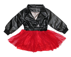 Leather tulle dress. Top part of dress is a leather jacket and the bottom has red tulle. The back of the dress is adorned with a huge diamond in sequins