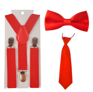 Red 3 piece set includes suspenders, bow tie and tie. Dress any outfit up with these adorable accessories!  The Tie comes on an elastic circle making it super easy to put on. The Bow tie has a small white dot design. 
