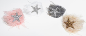
            
                Load image into Gallery viewer, Our Petite Hailey Accessories are stunning! These feather headbands are the perfect touch for your budding fashionista. They match all of our dresses in the collection and come in four colors. The glitter shaped star sits on top of a wide feather extending throughout the headpiece
            
        