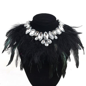 
            
                Load image into Gallery viewer, Our Diamond Glitz necklace is stunning!  This makes the perfect addition for our mini diva&amp;#39;s all the way up to our mama diva&amp;#39;s.This necklace sits high on top of your existing shirt and is lined with Solid black and hints of evergreen long feathers and shining crystals.  Mix and match with your mini for the perfect stylish accessory! 
            
        