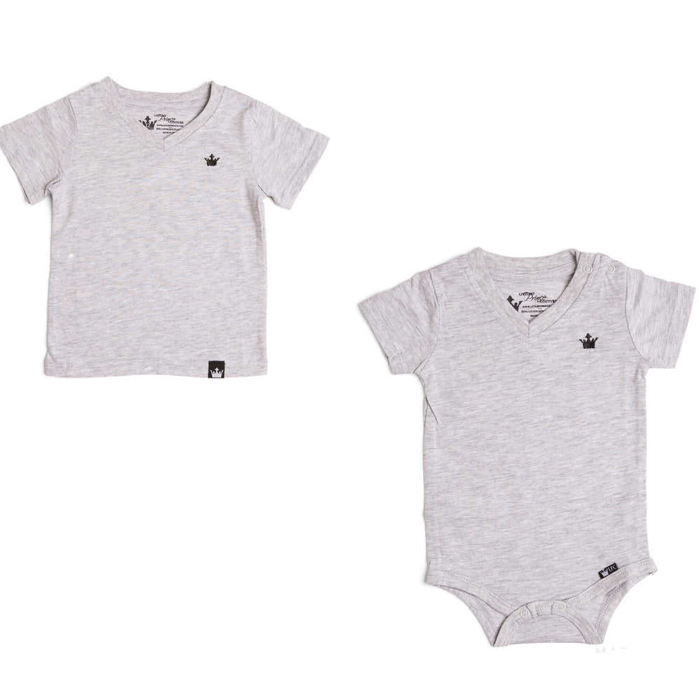 The Littlest Prince Gray Crown Logo Tee is sleek and simple which allows you to style it how you please! You can dress it up with a sports jacket or keep it cool with a pair of jeans. It is a v-neck style which keeps your little man totally stylish. Available in baby, toddler and tween sizes!