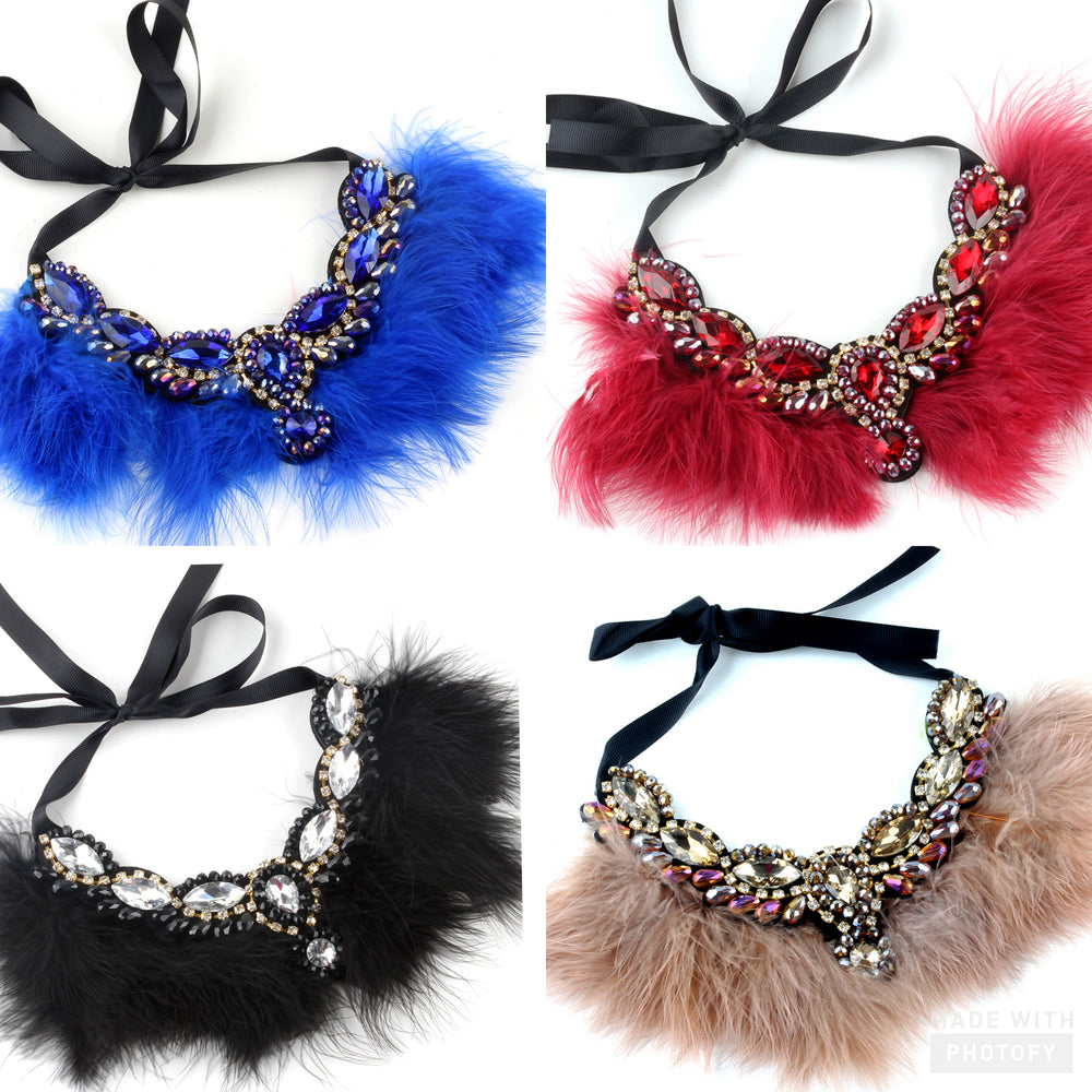 Calling all Boujie Diva's! Our crystal feather necklaces are the perfect addition for our mini diva's all the way up to our mama diva's. Each necklace sits high on top of your existing shirt and is lined with colorful feathers and shining crystals.  Mix and match with your mini for the perfect stylish accessory!  Available in beige, black, red and blue