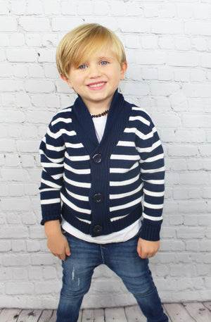 The Nautical baby/toddler boy sweater is a beautiful navy blue heavy knit sweater that will keep your little man nice and toasty. This sweater will fashionably last into winter and can be worn underneath a heavy coat if need be. It looks like a summer Hamptons vibe but will serve it's purpose during those cold winter nights. 