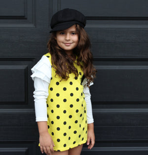 
            
                Load image into Gallery viewer, This fun polka dot dress is the perfect piece for a party! We have two vibrant colors in stock -Pink and Yellow. Both colors have long sleeves attached with ruffles on the shoulders. A bow sits on the left chest.
            
        