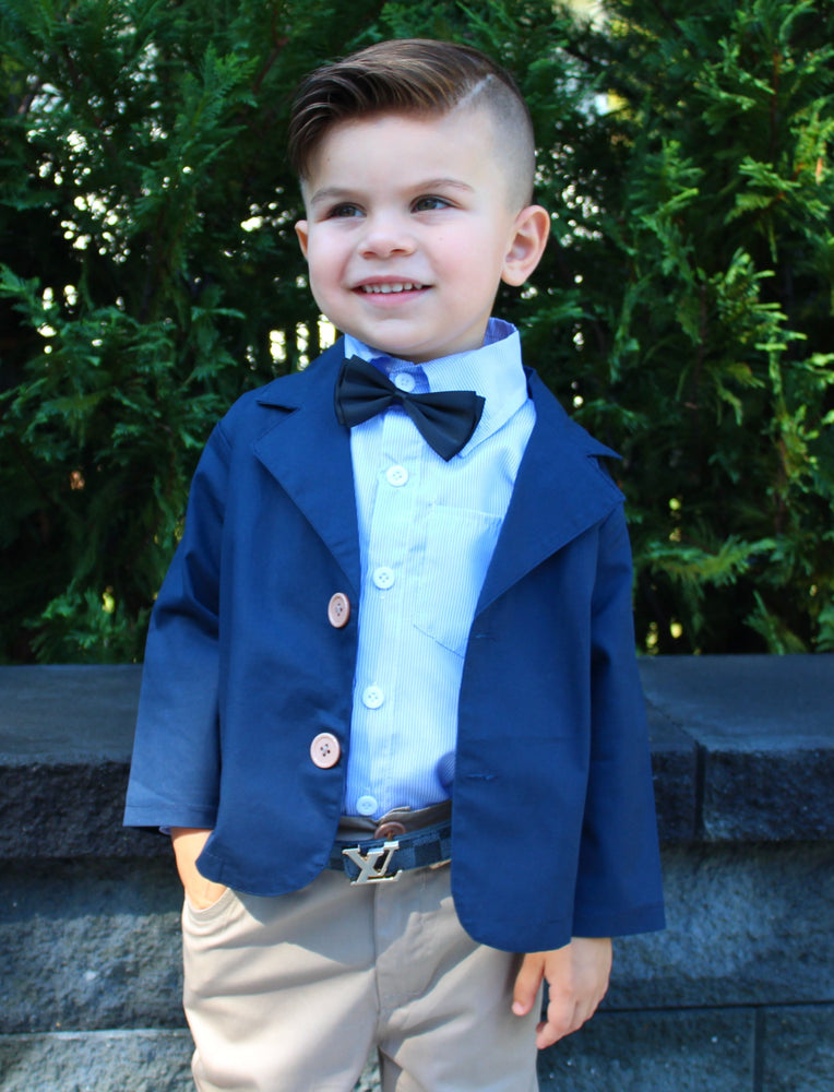The Benjamin 4 piece set is for our upper classman lil gents! This sophisticated toddler boy outfit will set the tone for his day. Let his style shine through with this 4 piece set. The set includes Long Sleeve Button Down, Collard Jacket (navy), Pants, Bow Tie (black). 