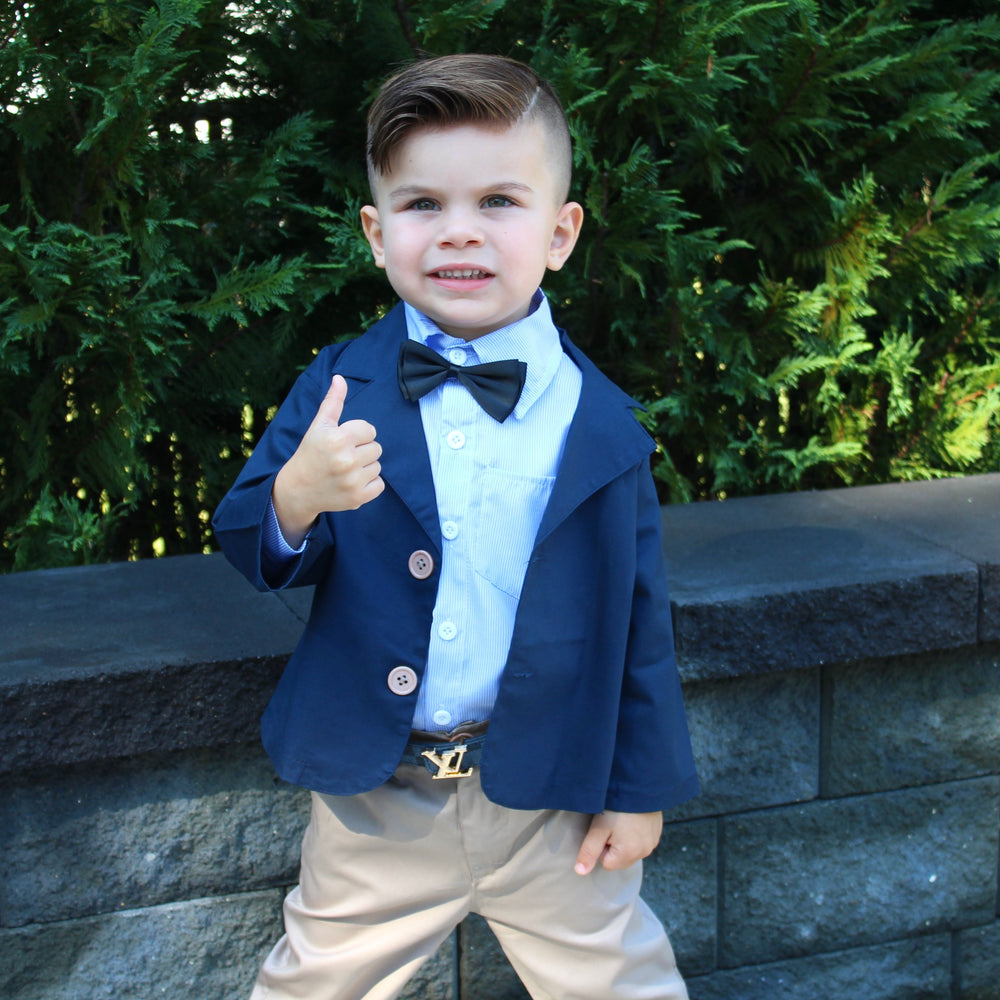 The Benjamin 4 piece set is for our upper classman lil gents! This sophisticated toddler boy outfit will set the tone for his day. Let his style shine through with this 4 piece set. The set includes Long Sleeve Button Down, Collard Jacket (navy), Pants, Bow Tie (black). 