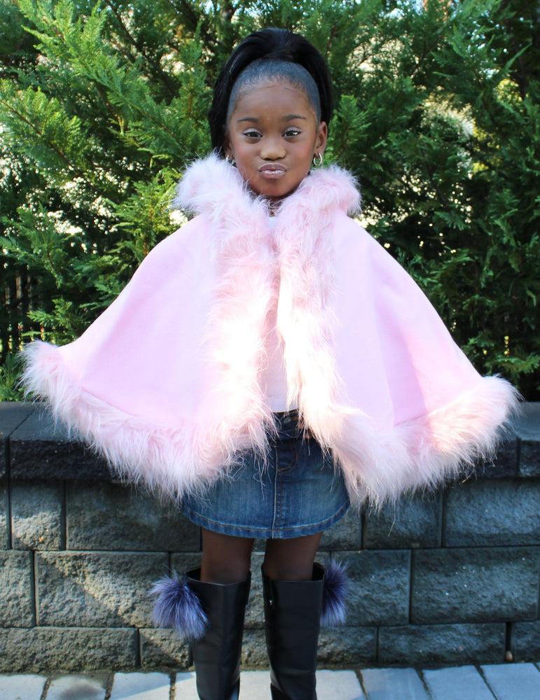 This gorgeous faux fur baby/toddler cape is perfect for your mini fashionistas to really stand out. This can be worn over jeans for a casual chic look or for the holidays over her fancy holiday outfit. Available in pink or white.